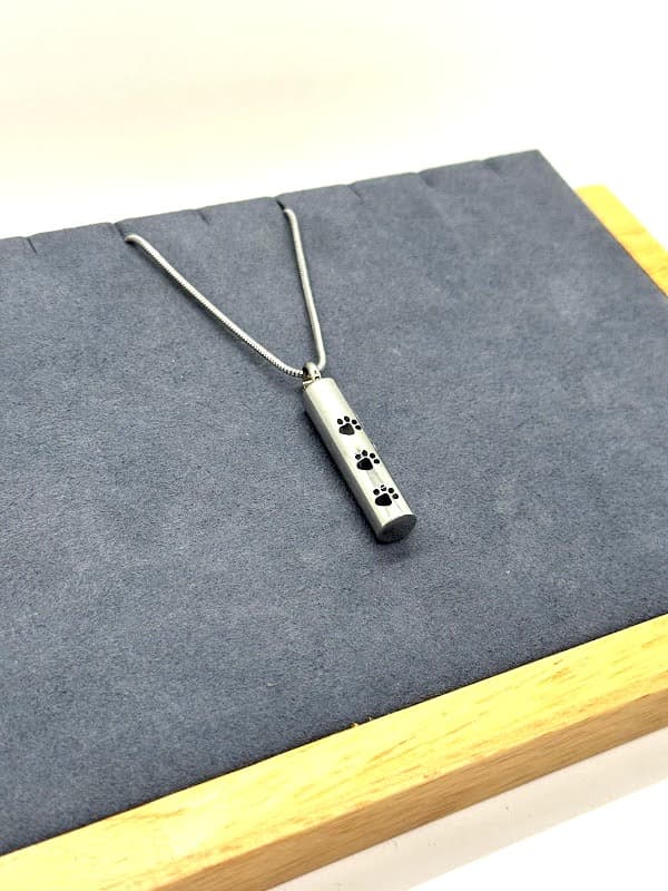 Sleek Cylinder Necklace with Paw Prints