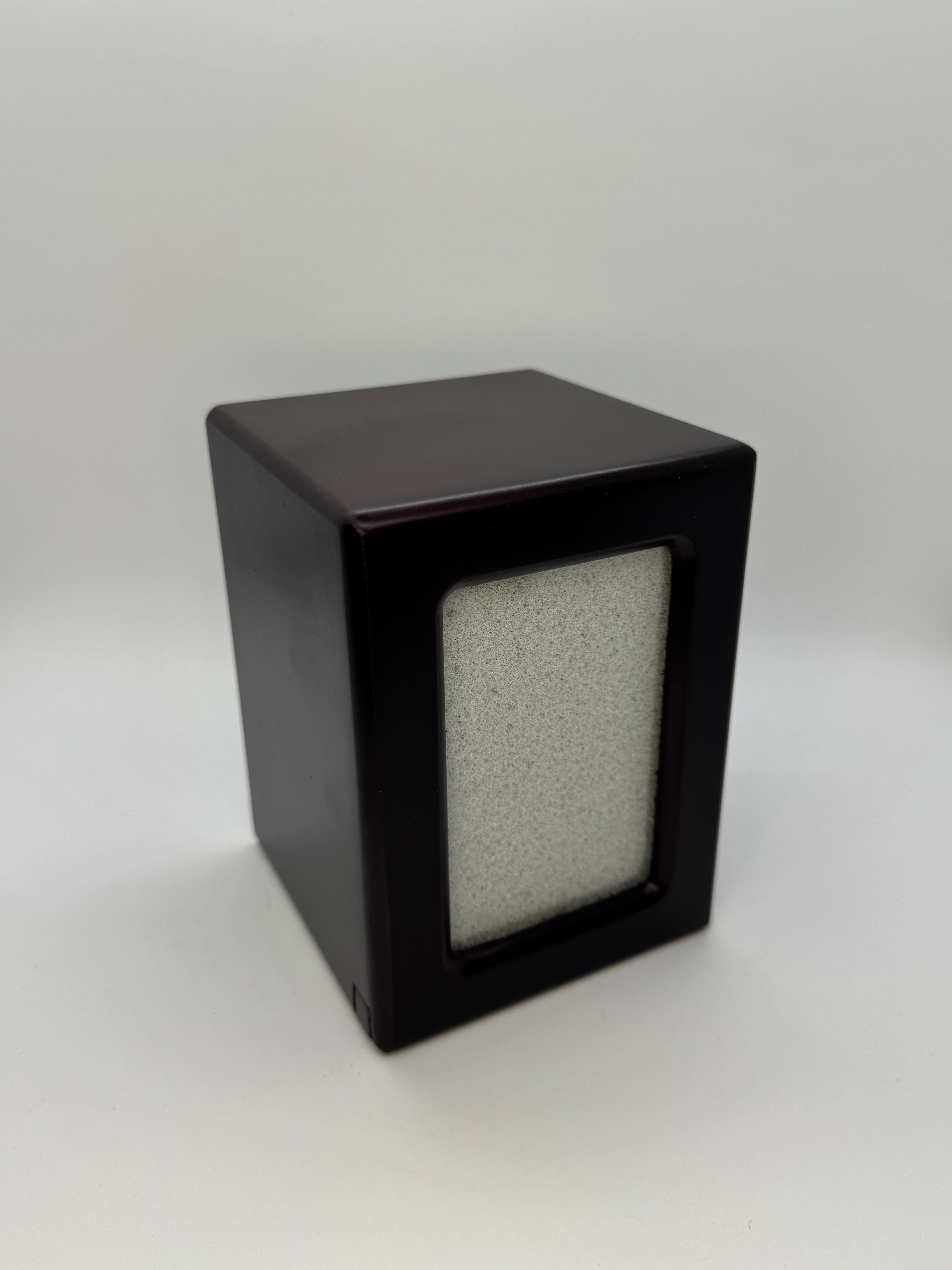 A dark cherry-finish photo urn with a framed window for your favorite picture.
